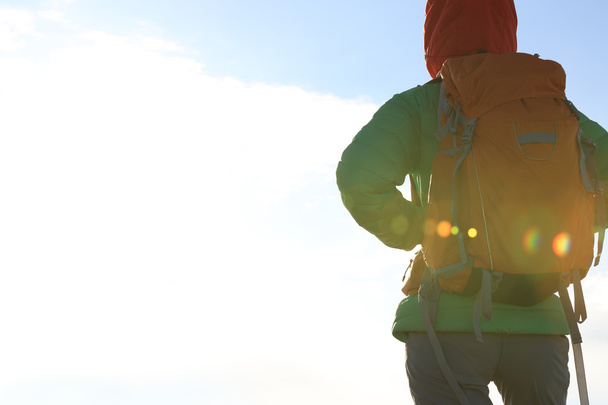 woman backpacker on mountain peak - Фото, зображення