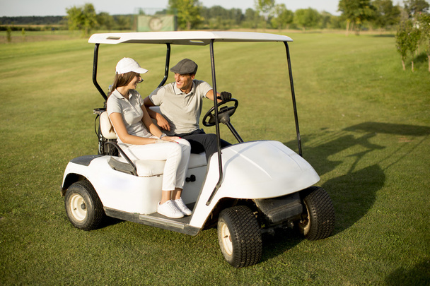 Couple en voiturette de golf
 - Photo, image