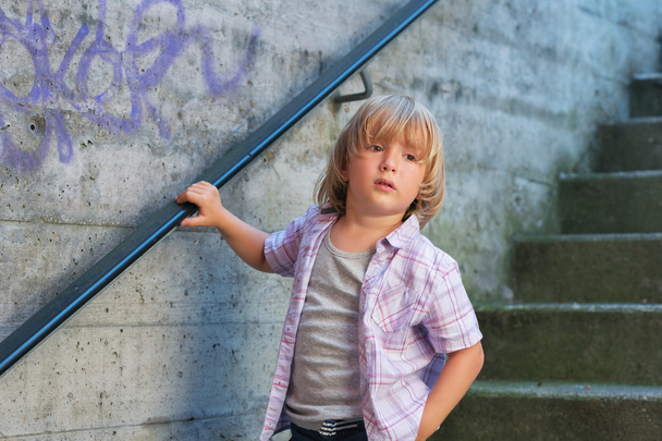 Outdoor fashion portrait of adorable little boy wearing purple shirt - Photo, Image