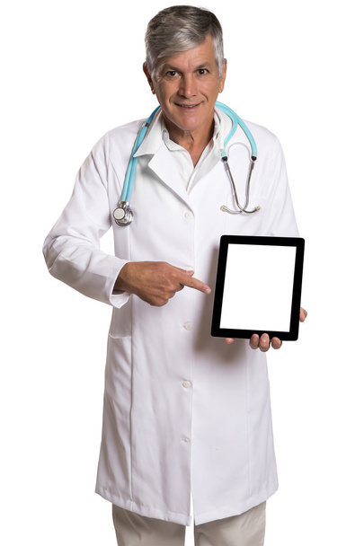 Doctor checking patient notes on a tablet-pc standing with his stethoscope - Foto, Imagem