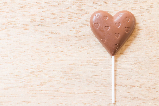 Chocolate hearts candies on wooden background - Photo, Image