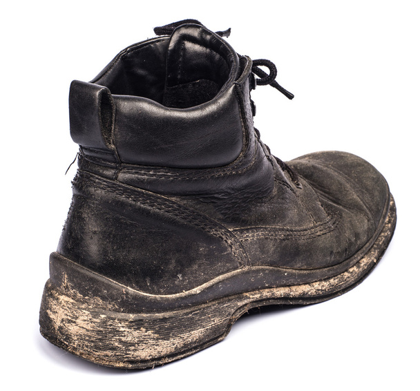 Old dirty boots on a white background - 写真・画像