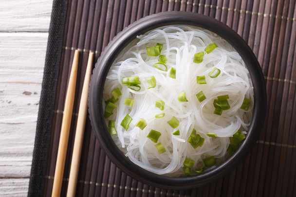 Asian crystal noodles close up in a bowl. horizontal top view - Foto, Imagem
