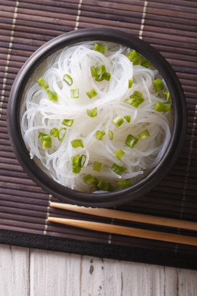 Asian crystal noodles close up in a bowl. vertical top view - Foto, Imagem