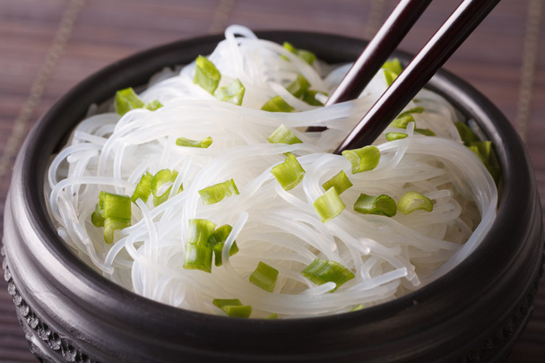 Cellophane noodles with green onions in a bowl closeup. horizont - Photo, Image