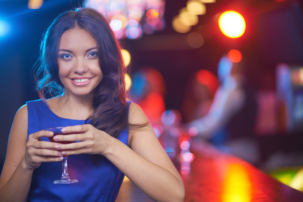 young brunette with cocktail - Photo, Image