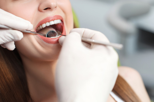 Professional dental doctor is treating female health - Fotoğraf, Görsel