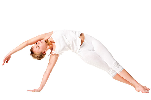 Young woman doing yoga exercise - Fotografie, Obrázek