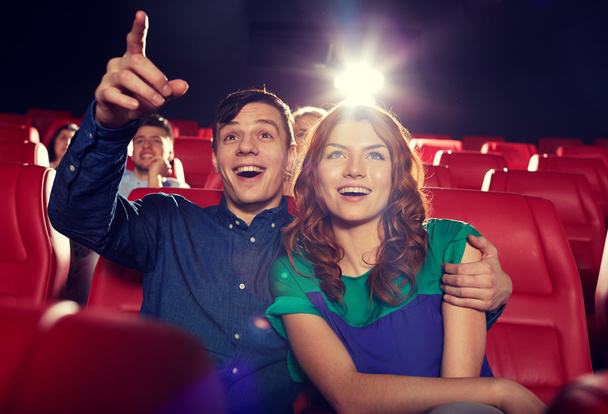 happy friends watching movie in theater - Фото, изображение