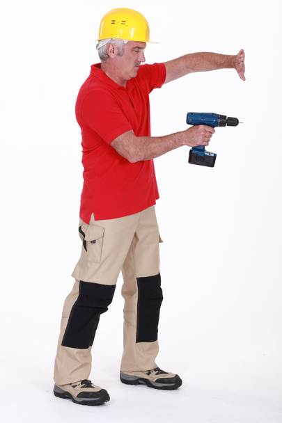 Tradesman using a power tool - Fotografie, Obrázek