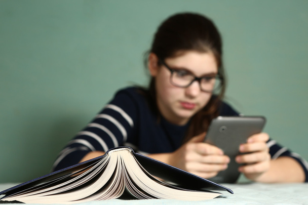 teenager girl in myopia glasses play online game  - Photo, Image