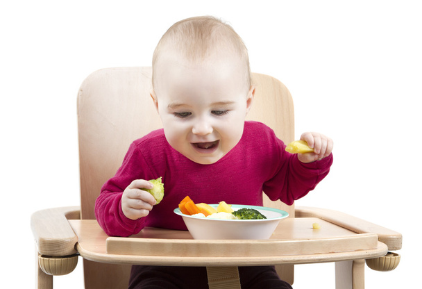 幼児高い椅子で食べる - 写真・画像