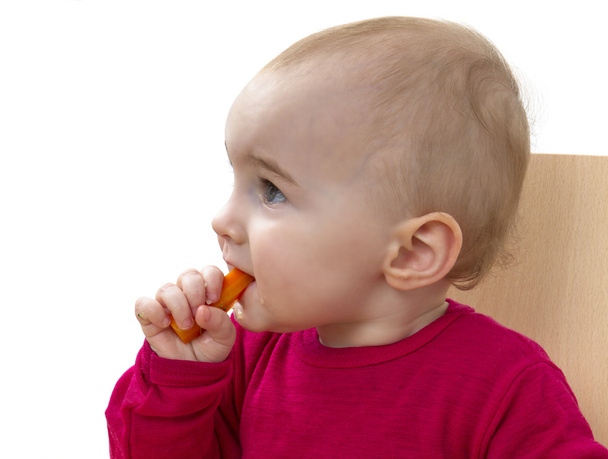 Child in red shirt eating - Φωτογραφία, εικόνα