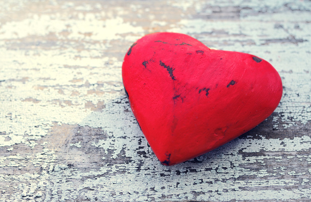 Red heart on a grunge wooden old background. - Photo, Image