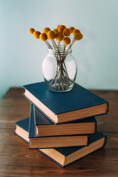 Stack of books and flowers - Fotoğraf, Görsel
