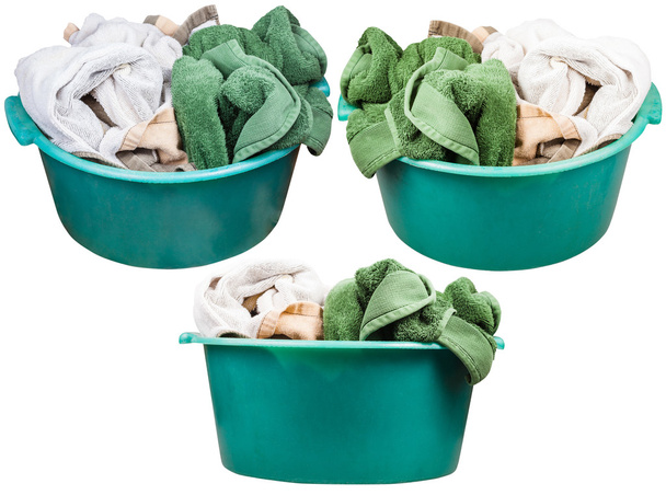 set of round green plastic washbasins with towels - Fotografie, Obrázek