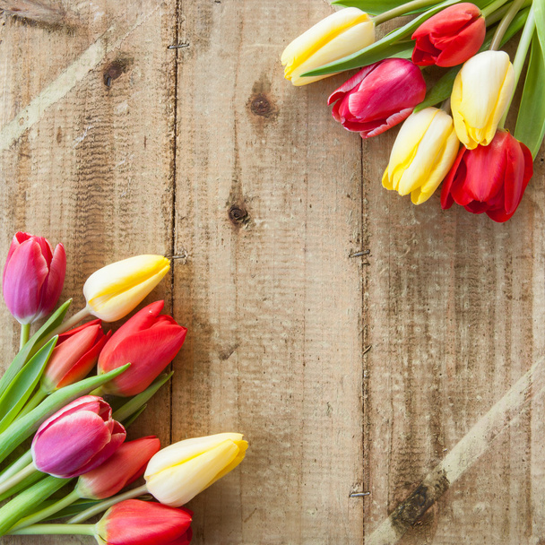 Fresh tulips on wooden background - Fotografie, Obrázek