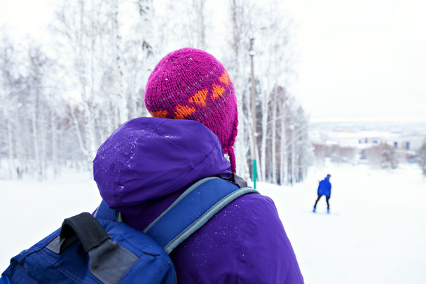 Ski slope. girl with a backpack - Фото, зображення