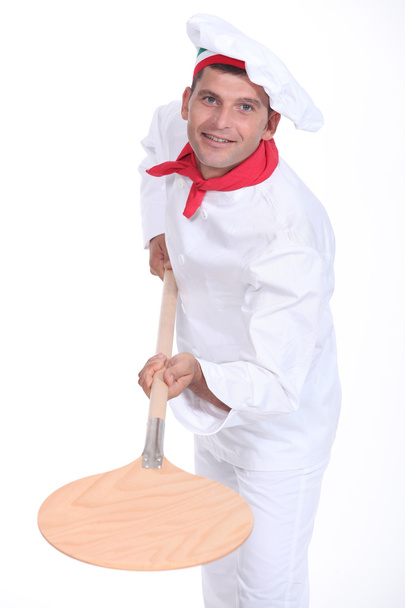 Pizzaiolo holding a peel - Foto, immagini