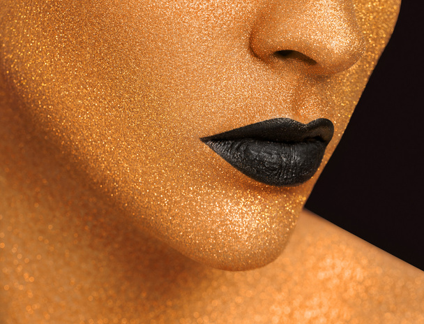 Golden Woman's Face Close up. Futuristic Gilded Make-up. Painted Skin - Foto, Bild