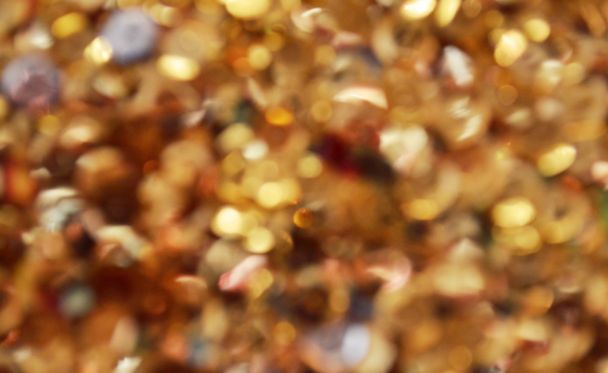 Bright and abstract blurred star golden background with shimmering glitter - Photo, image