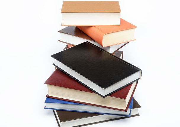A stack of books on a white background. - Foto, afbeelding