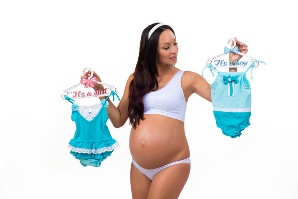 Pregnant woman wondering gender of baby: girl, boy or twins? - Foto, afbeelding