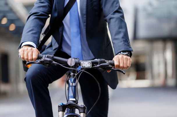 Successful businessman riding bicycle - Foto, Imagem