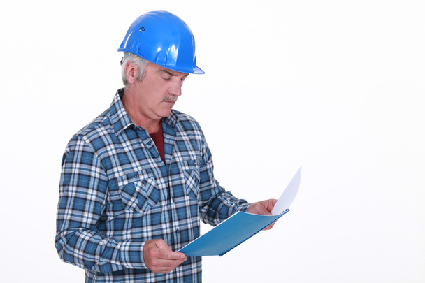 Engineer reading a report - Photo, Image