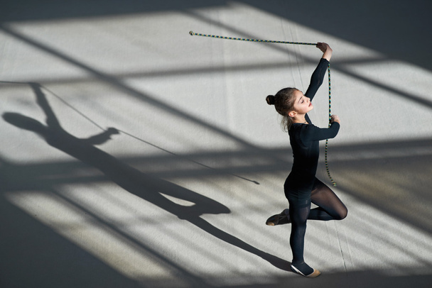 Girl exercising with rope on  rhythmic gymnastics - Zdjęcie, obraz