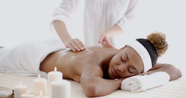 Female therapist doing back massage - Photo, Image