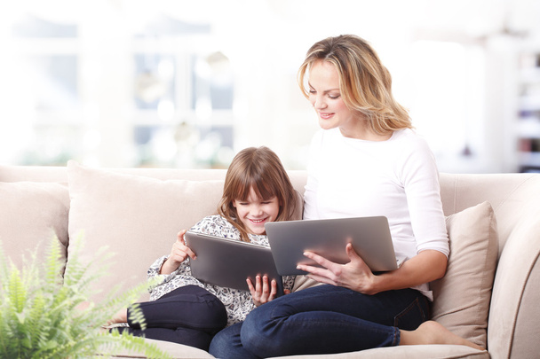 mother and daughter using tablet - 写真・画像