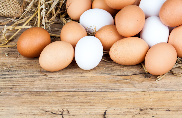 Eggs on wooden background - Foto, Imagen