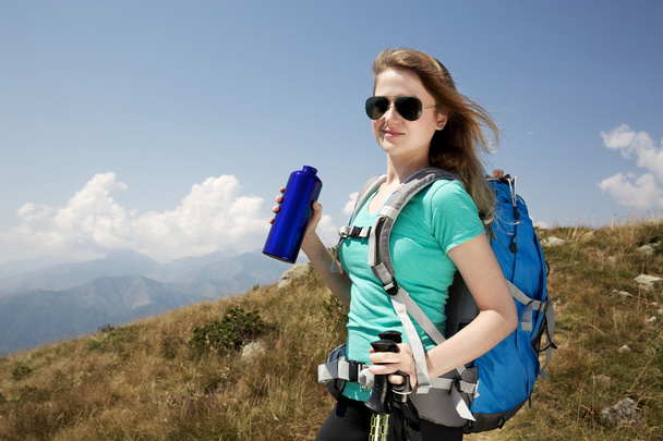 woman hiker walking through the mountains - Photo, Image