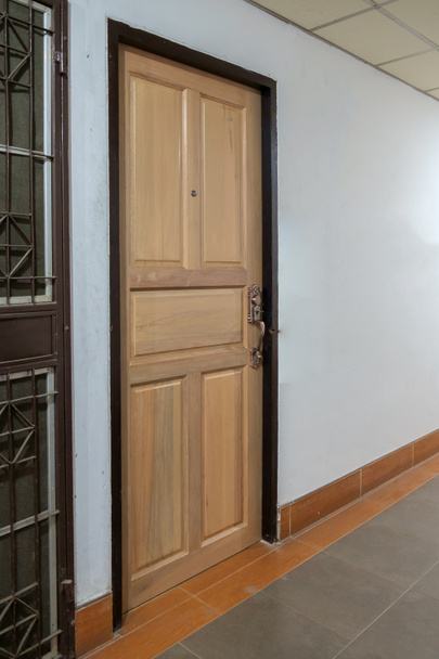 Closed wooden door in the building - Photo, Image