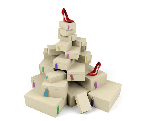 Pile of shoe boxes with red high-heeled shoe on the top - Photo, Image