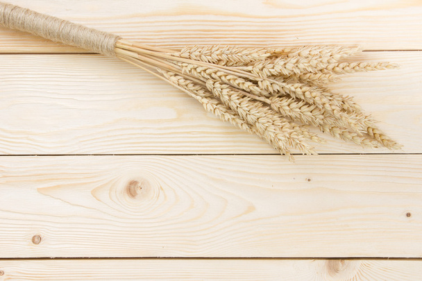 Sheaf of Wheat over Wood Background. Harvest concept. Top view - Fotó, kép