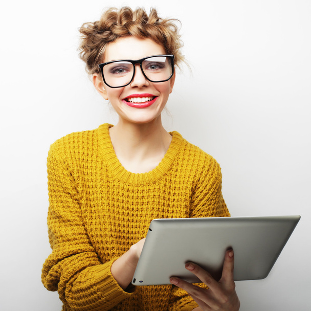 happy teenage girl wearing glasses with tablet pc computer - Photo, Image