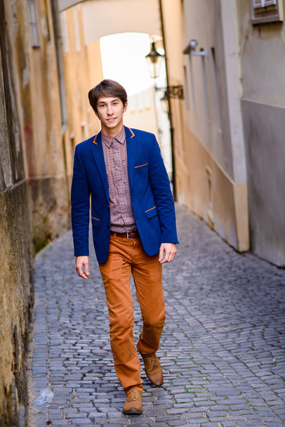 man in beige pants and a blue blazer - Photo, Image