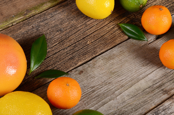 Allsorts from a citrus on wooden background - Zdjęcie, obraz
