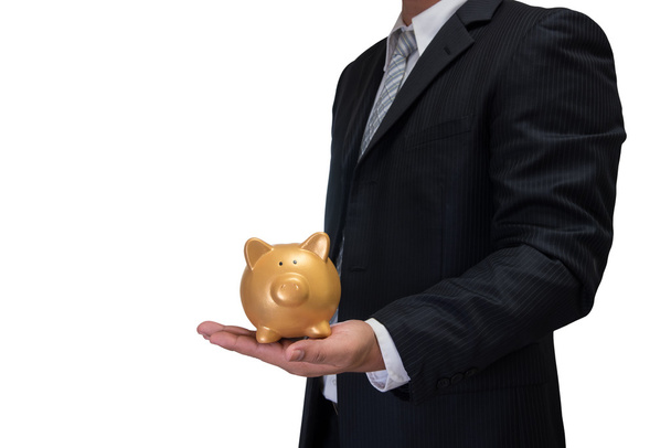 business man in black suite with gold piggy bank isolated on whi - Photo, Image
