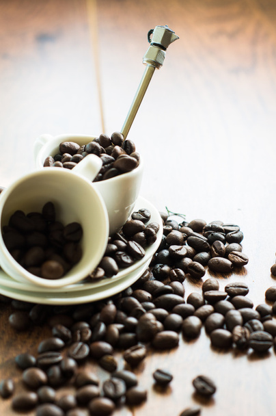 Granos de café en la taza
 - Foto, Imagen