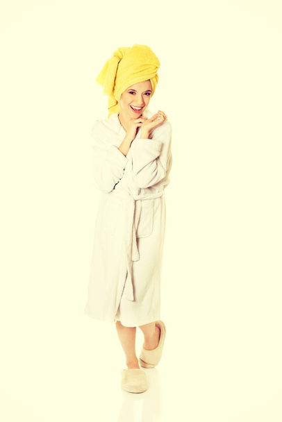 Young smiling woman in bathrobe - Photo, image