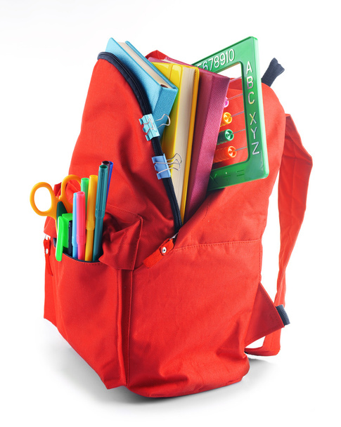 Red backpack with colourful stationary  - Zdjęcie, obraz