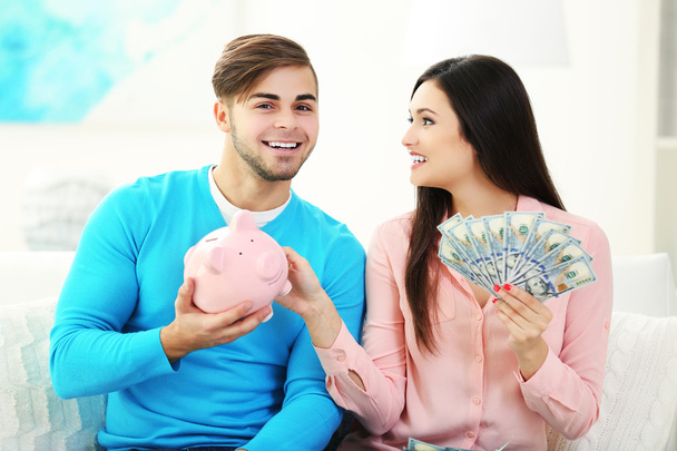 Happy couple counting money - Фото, зображення