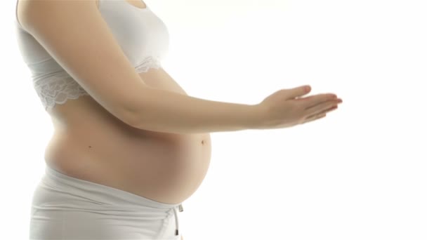Mujer embarazada mostrando el pulgar
 - Imágenes, Vídeo