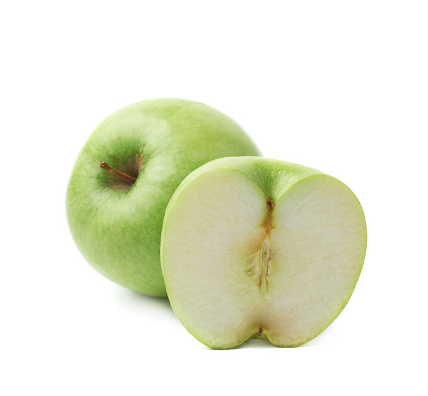 Green apple next to a slice isolated - Photo, image