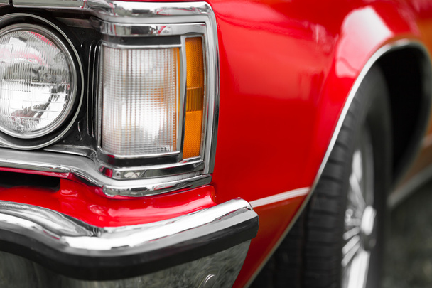 Right headlights of a red classic car - Photo, Image