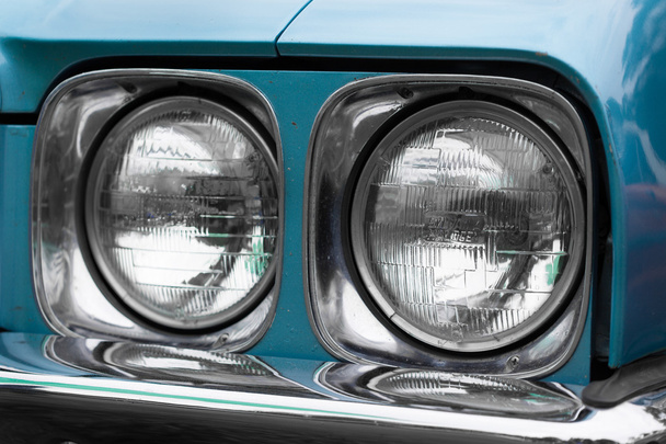Right headlights of a blue vintage car - Photo, Image