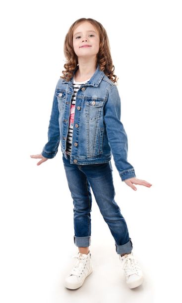 Cute smiling little girl in jeans isolated - Foto, immagini